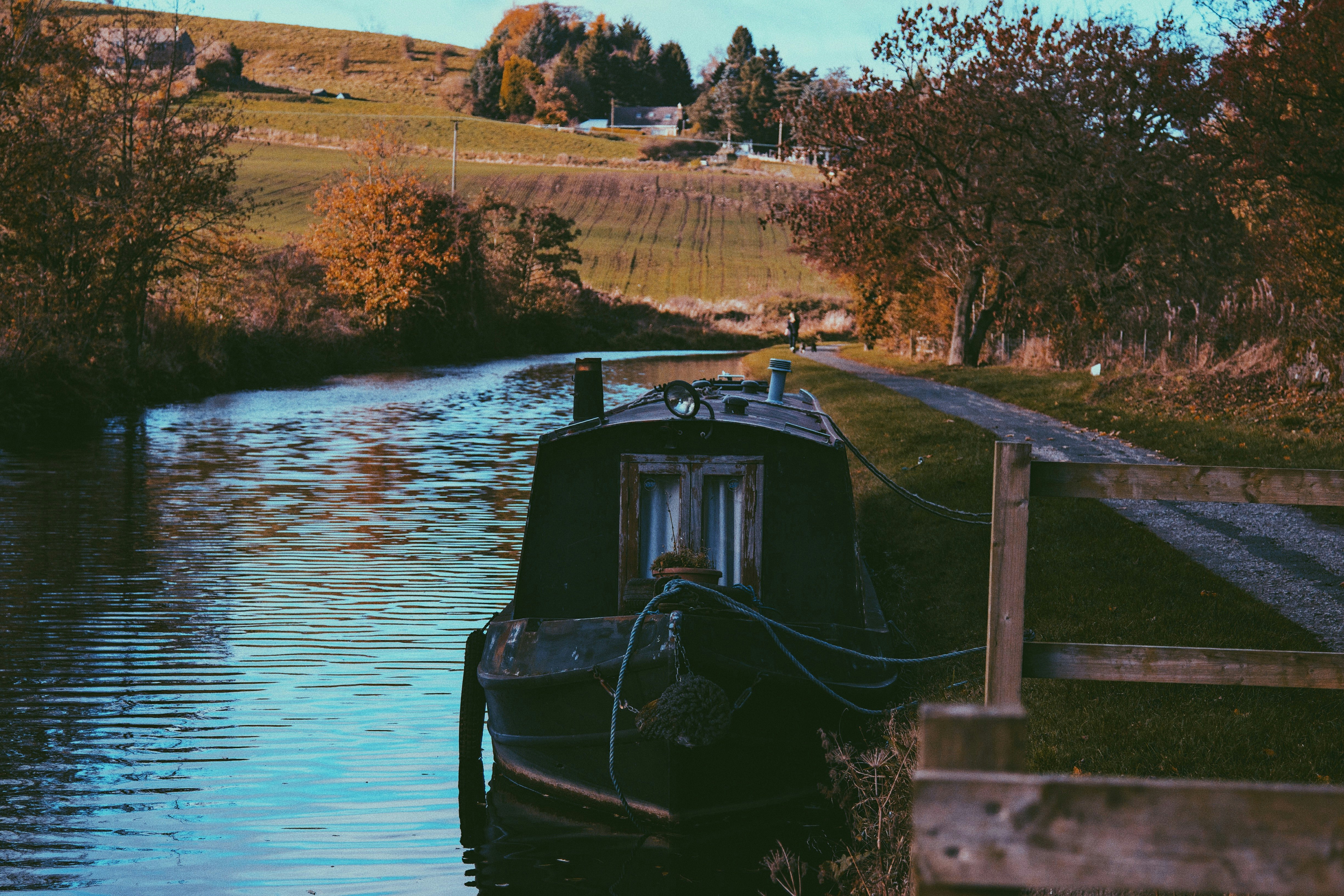 black boat on body of water